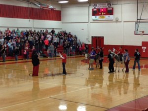 Donkey Basketball Photo - Donkeys carrying flag bearer